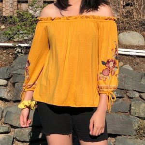 Yellow off the shoulder top with flowers